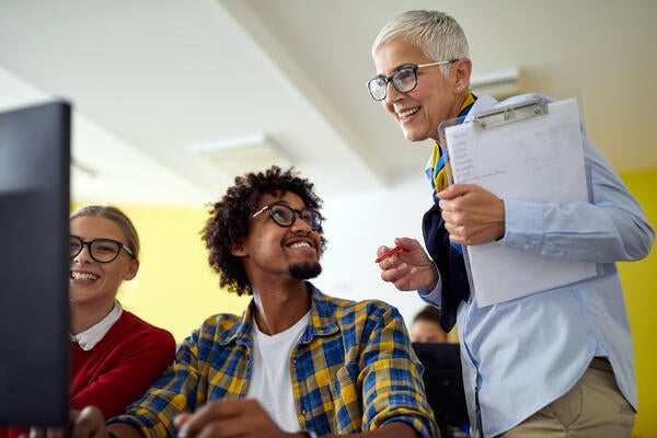 Professor helping students